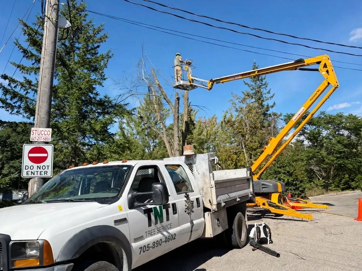 Bucket truck working beside hydro lines